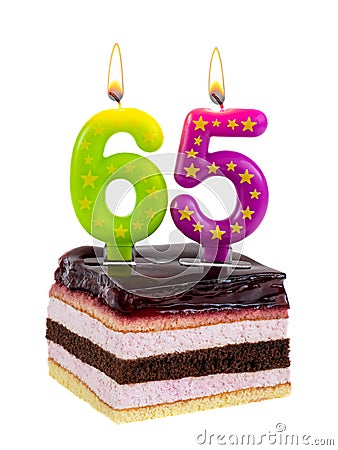 Birthday cake with burning candles for 65th anniversary Stock Photo