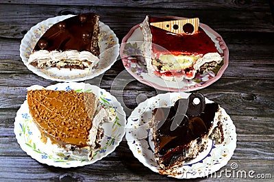 A birthday cake, four different quarters spongy creamy cake for celebrations, biscuits and cream, hazelnut chocolate spread, Stock Photo