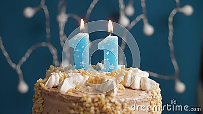 Birthday cake with 11 number candle on blue backgraund Stock Photo