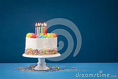 Colorful Birthday Cake over Blue Stock Photo