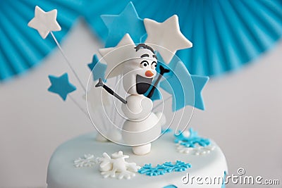 Birthday cake with snowman and stars on white background. Stock Photo