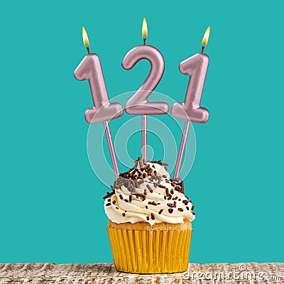 Birthday card with number 121 candle on aquamarine background Stock Photo