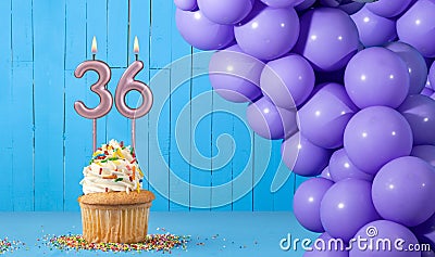 Birthday card with number 36 candle, cupcake and balloons Stock Photo