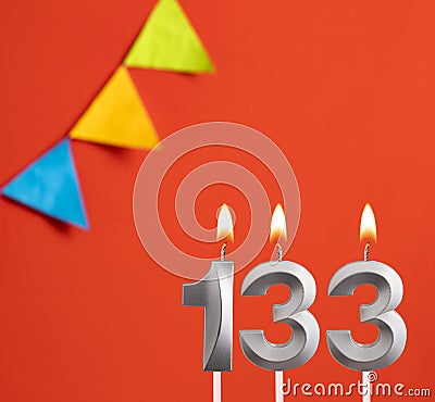 Birthday card - Number 133 candle in orange background Stock Photo