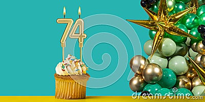 Birthday card number 74 - Cupcake with balloons Stock Photo