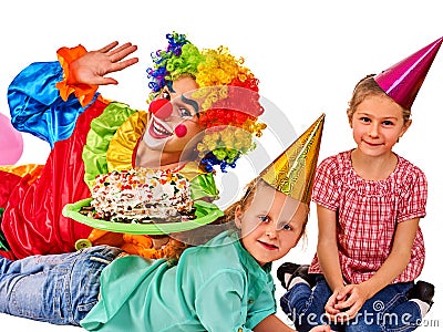 Birthday child clown playing with children. Kid cakes celebratory. Stock Photo