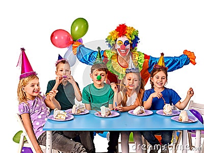 Birthday child clown playing with children. Kid holiday cakes celebratory. Stock Photo