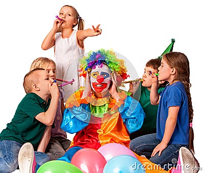 Birthday clown close ears of children`s noise with group children. Stock Photo