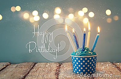 Birthday concept with cupcake and candles. Stock Photo