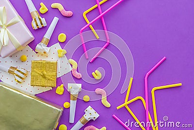 Birthday concept with gifts, greeting cards and party whistles on violet background top view copyspace Stock Photo