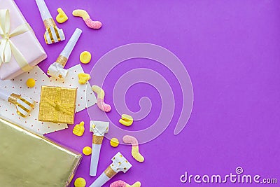 Birthday concept with gifts, greeting cards and party whistles on violet background top view copyspace Stock Photo