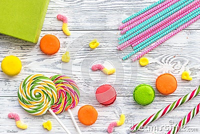 Birthday concept with wrapped gift and sweets on grey wooden desk top view Stock Photo