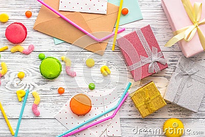 Birthday concept with wrapped gifts, greeting cards and sweets on grey wooden background top view Stock Photo