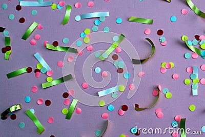 Texture festive confetti scattered on lilac background Stock Photo