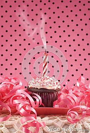 Birthday Cupcake with One Smoking Candle Stock Photo