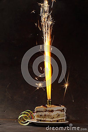 Birthday dessert cake with lighted fireworks Stock Photo