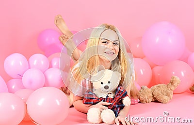Birthday girl concept. Woman cute celebrate birthday with balloons. Girl in pajama, domestic clothes lay near air Stock Photo