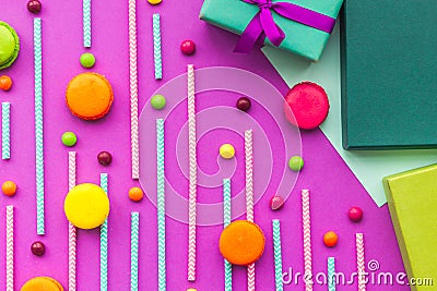 Birthday greeting cards, wrapped gifts and sweets on fuchsia background top view Stock Photo