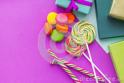 Birthday greeting cards, wrapped gifts and sweets on fuchsia background top view copyspace Stock Photo