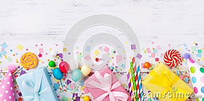 Birthday party banner or background with gift or present boxes, holiday supplies and confetti. Top view Stock Photo