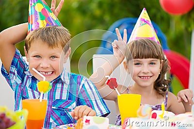 Birthday party with colorful cake at backyard Stock Photo