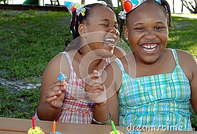 Birthday party sisters Stock Photo