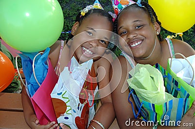 Birthday party sisters Stock Photo