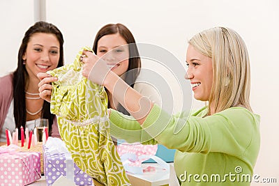 Birthday party - woman unwrap present, surprise Stock Photo