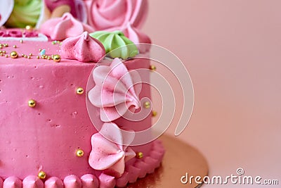 Birthday strawberry cake decorated with cream and meringue roses and caramel balls Stock Photo