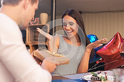 Birthday woman wondering about nice unexpected present Stock Photo