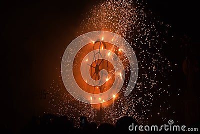 BIRZEBBUGA, MALTA - Aug 01, 2015: Ground fireworks display, mechanised fire display on metal frame during the village feasts in Stock Photo