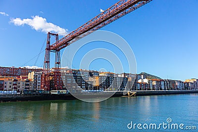 Biscay bridge flying with gondola over river Nervion. Portugalete landmark. Famous bridge called Puente de Vizcaya near Bilbao. Editorial Stock Photo