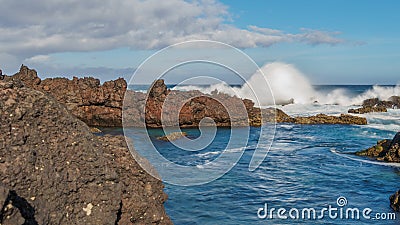 Biscoitos breaking waves in Terceira, wide angle Stock Photo