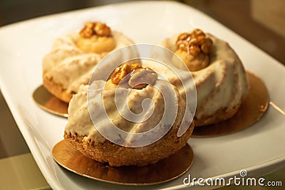 Biscuit cupcakes with caramel syrup and nuts Stock Photo