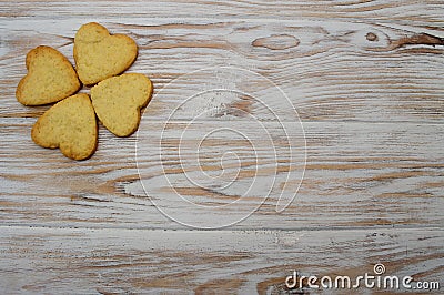 Biscuit on wooden background leaf clover hearts St. Patrick St. Valentine holiday celebration Stock Photo