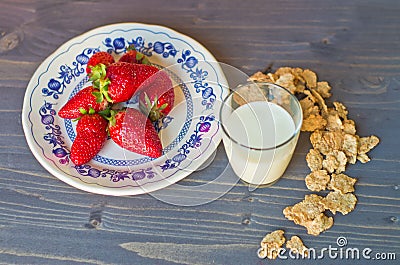 Biscuits, cornflakes, strawberry and milk Stock Photo