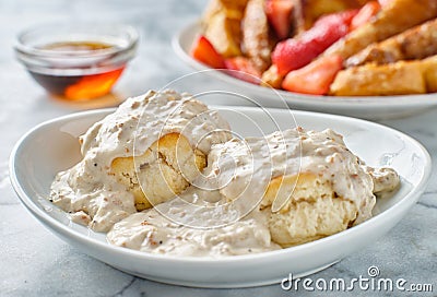 Biscuits and gravy with sausage on plate Stock Photo