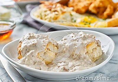 Biscuits and gravy with sausage on plate Stock Photo