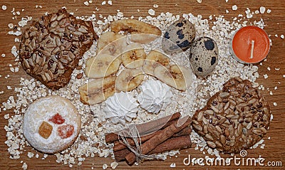 Biscuits oats flakes cinnamon sticks on a wooden table Stock Photo