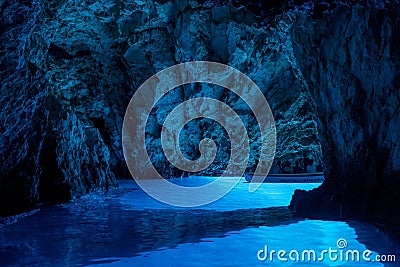 Bisevo, Croatia - Aug 16, 2020: Tourists on a boat in serene blue cave near Komiza island Editorial Stock Photo