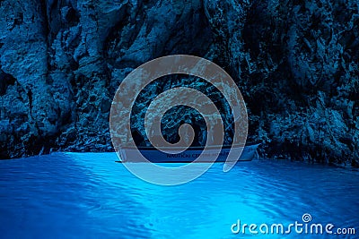 Bisevo, Croatia - Aug 16, 2020: Tourists on a boat in serene blue cave near Komiza island Editorial Stock Photo