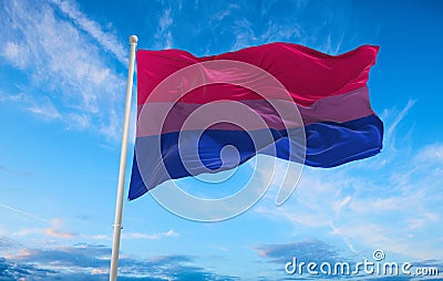 Bisexual Pride flag waving in the wind at cloudy sky. Freedom and love concept. Pride month. activism, community and freedom Cartoon Illustration