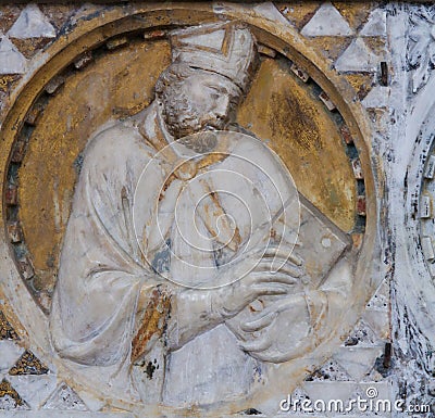 Bishop sculpture in the Church of Sant Agostino in San Gimignano, Italy Stock Photo
