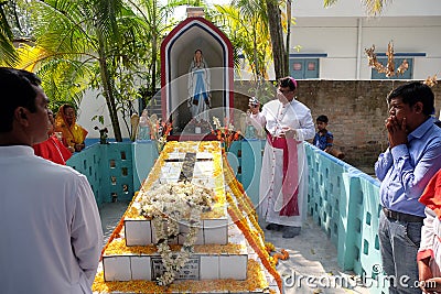 Bishop Shyamal Bose leads prayer at the tomb of Croatian missionary, Jesuit father Ante Gabric in Kumrokhali, West Bengal, India Editorial Stock Photo