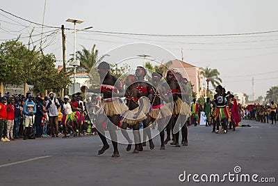 Group of girls performing during the Carnival Celebrations in the city of Bisssau Editorial Stock Photo
