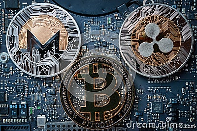 Bit coin Gold Cryptocurrency on Computer electronic circuit board motherboard. Litecoin, Ethereum CryptoCash Technology Editorial Stock Photo
