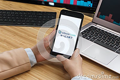 Bitbank Cryptocurrency Exchange Market. Female Trader Hands Holding the Smartphone Using Application. Crypto Background Concept, Editorial Stock Photo