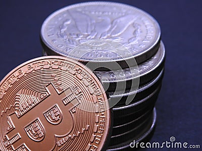 Bitcoin and antique Silver Morgan Dollars Stock Photo