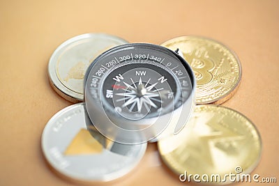 Bitcoin and altcoin with compass. Stock Photo