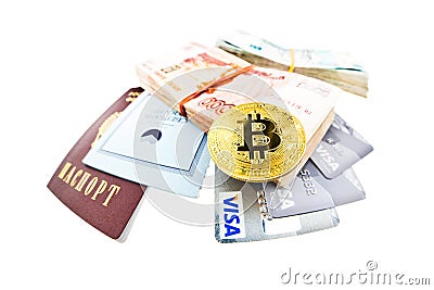 Bitcoin coin, Visa plastic cards and bank book of Sberbank Editorial Stock Photo